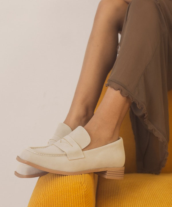 Introducing June Square Toe Penny Loafers, a timeless blend of sophistication and comfort. Crafted with precision, these loafers feature a sleek square toe design that effortlessly merges classic style with contemporary flair. The genuine leather construction ensures durability, while the penny strap adds a touch of refined detail.