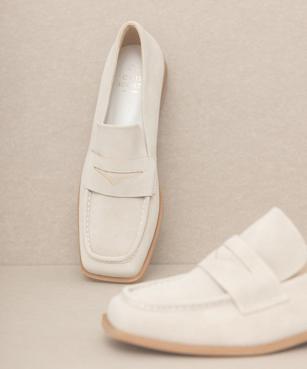 Introducing June Square Toe Penny Loafers, a timeless blend of sophistication and comfort. Crafted with precision, these loafers feature a sleek square toe design that effortlessly merges classic style with contemporary flair. The genuine leather construction ensures durability, while the penny strap adds a touch of refined detail.