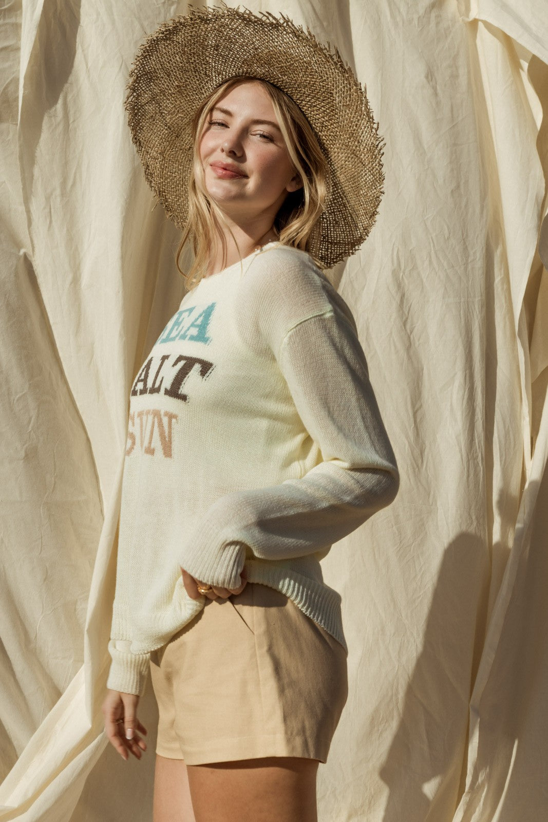Capture the essence of coastal charm with our Sea Salt Sun Sweater. This sweater exudes relaxed elegance with its round neckline and long sleeves, perfect for cool days by the sea or cozy evenings at home.