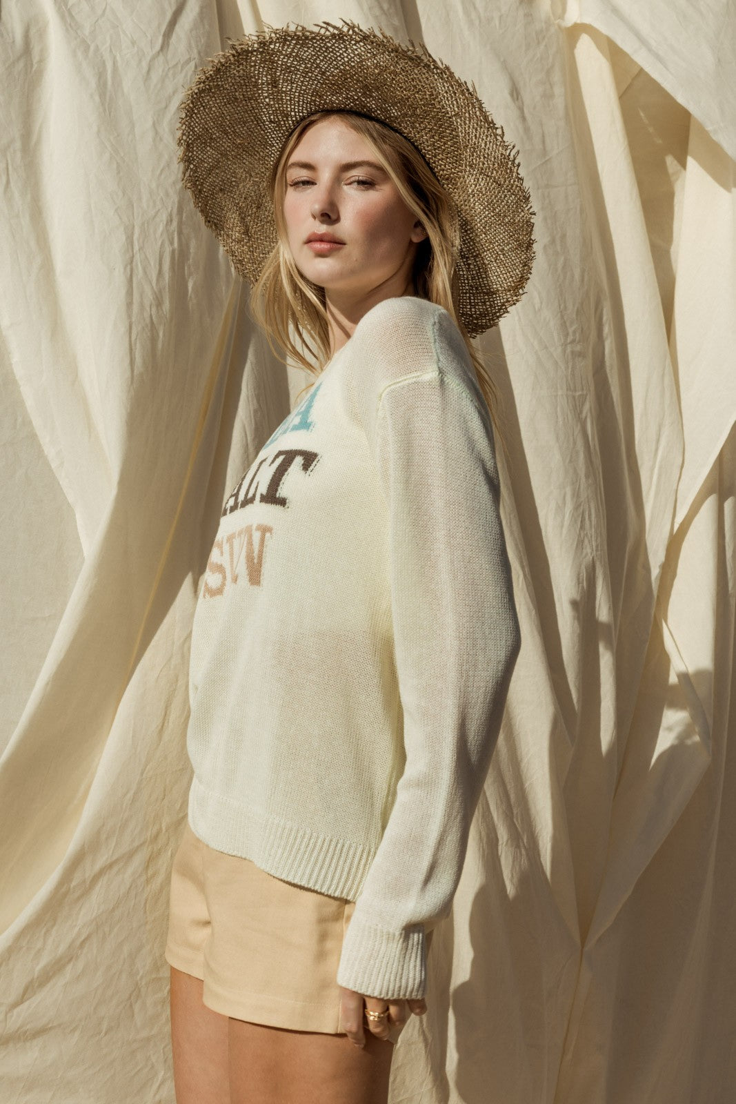 Capture the essence of coastal charm with our Sea Salt Sun Sweater. This sweater exudes relaxed elegance with its round neckline and long sleeves, perfect for cool days by the sea or cozy evenings at home.