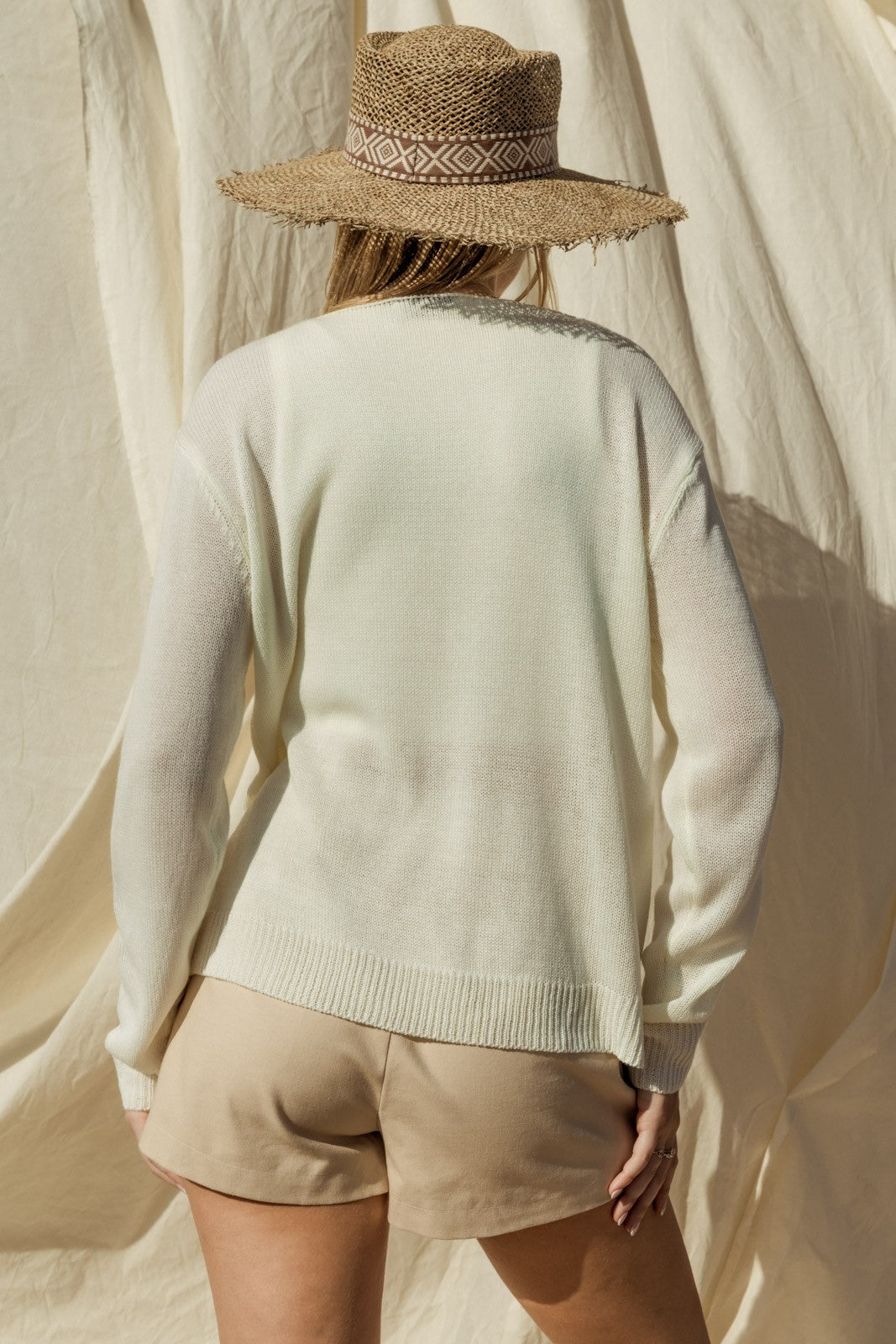 Capture the essence of coastal charm with our Sea Salt Sun Sweater. This sweater exudes relaxed elegance with its round neckline and long sleeves, perfect for cool days by the sea or cozy evenings at home.