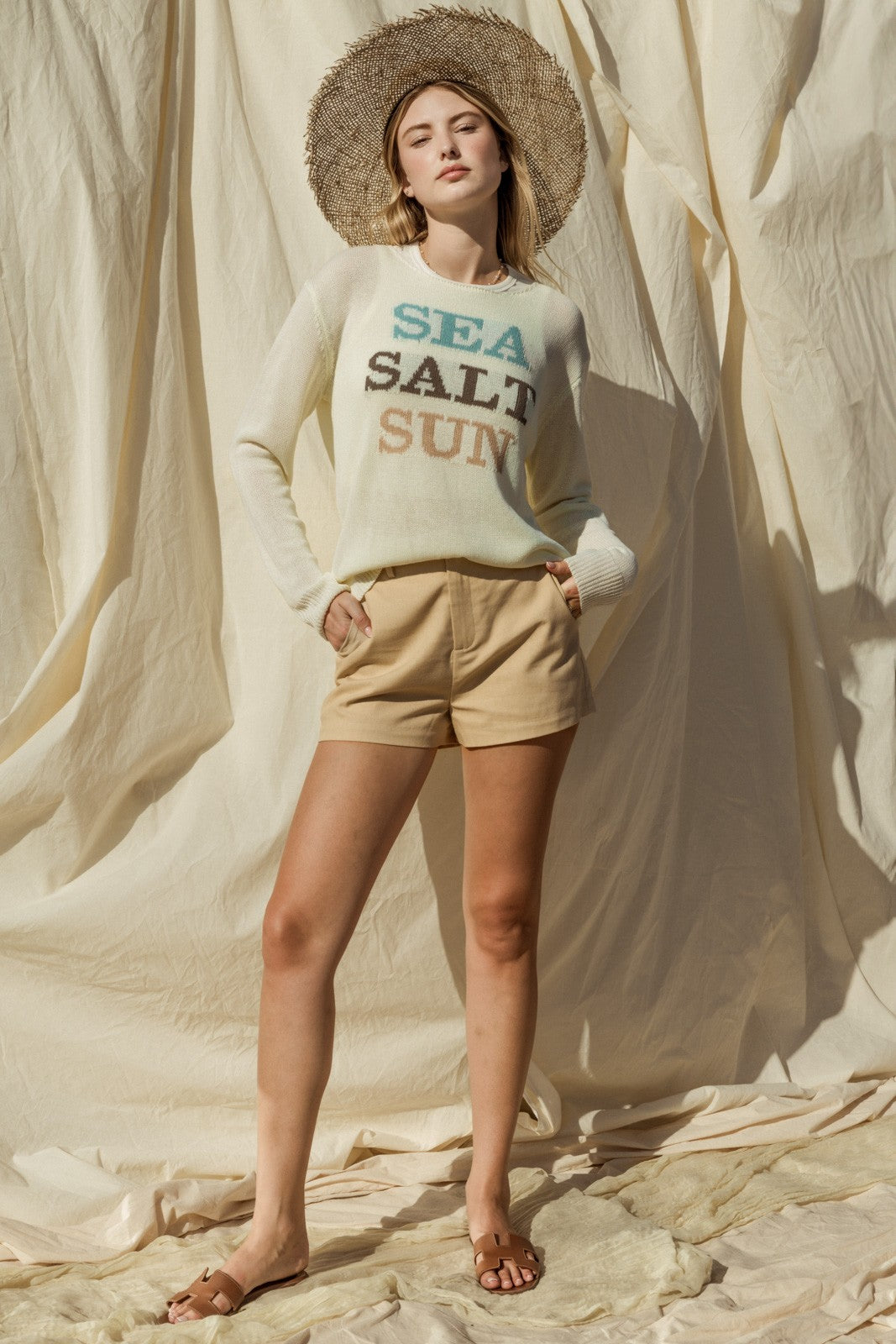 Capture the essence of coastal charm with our Sea Salt Sun Sweater. This sweater exudes relaxed elegance with its round neckline and long sleeves, perfect for cool days by the sea or cozy evenings at home.