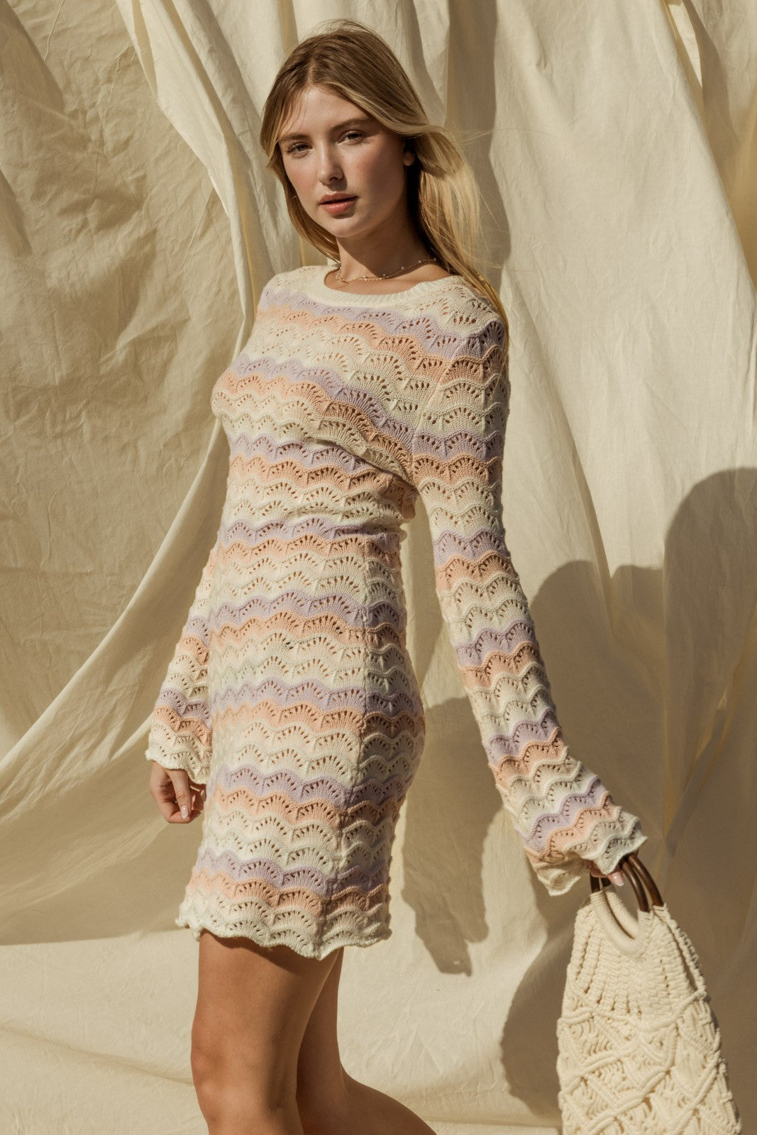 Introducing our Penelope Bell Sleeve Sweater Dress, a chic and stylish for your summer beach wardrobe. This dress features a classic round neckline and elegant bell sleeves, adding a touch of flair to your ensemble. Perfect for chilly nights by the beach or just a coverup for after your swim. 
