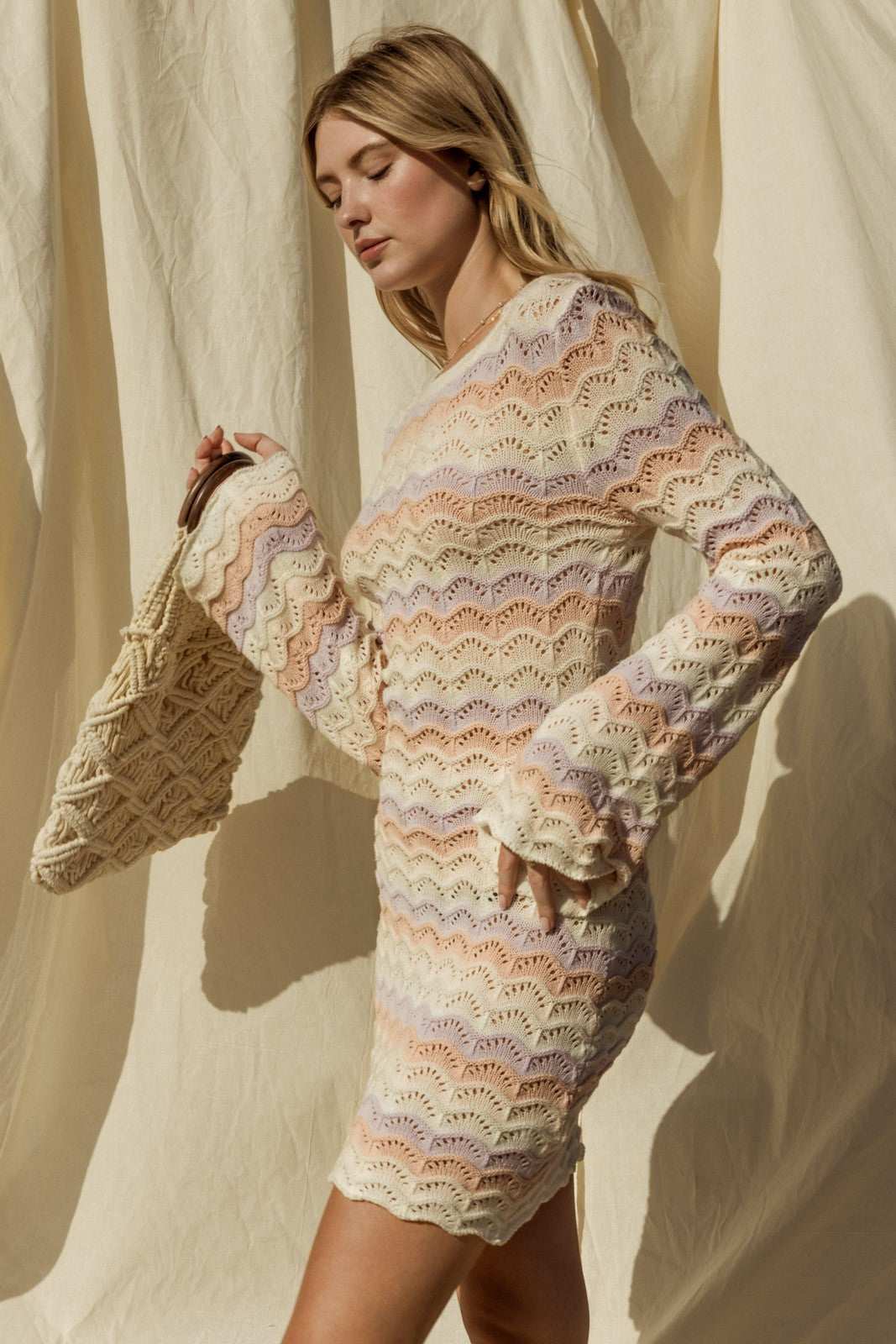 Introducing our Penelope Bell Sleeve Sweater Dress, a chic and stylish for your summer beach wardrobe. This dress features a classic round neckline and elegant bell sleeves, adding a touch of flair to your ensemble. Perfect for chilly nights by the beach or just a coverup for after your swim. 