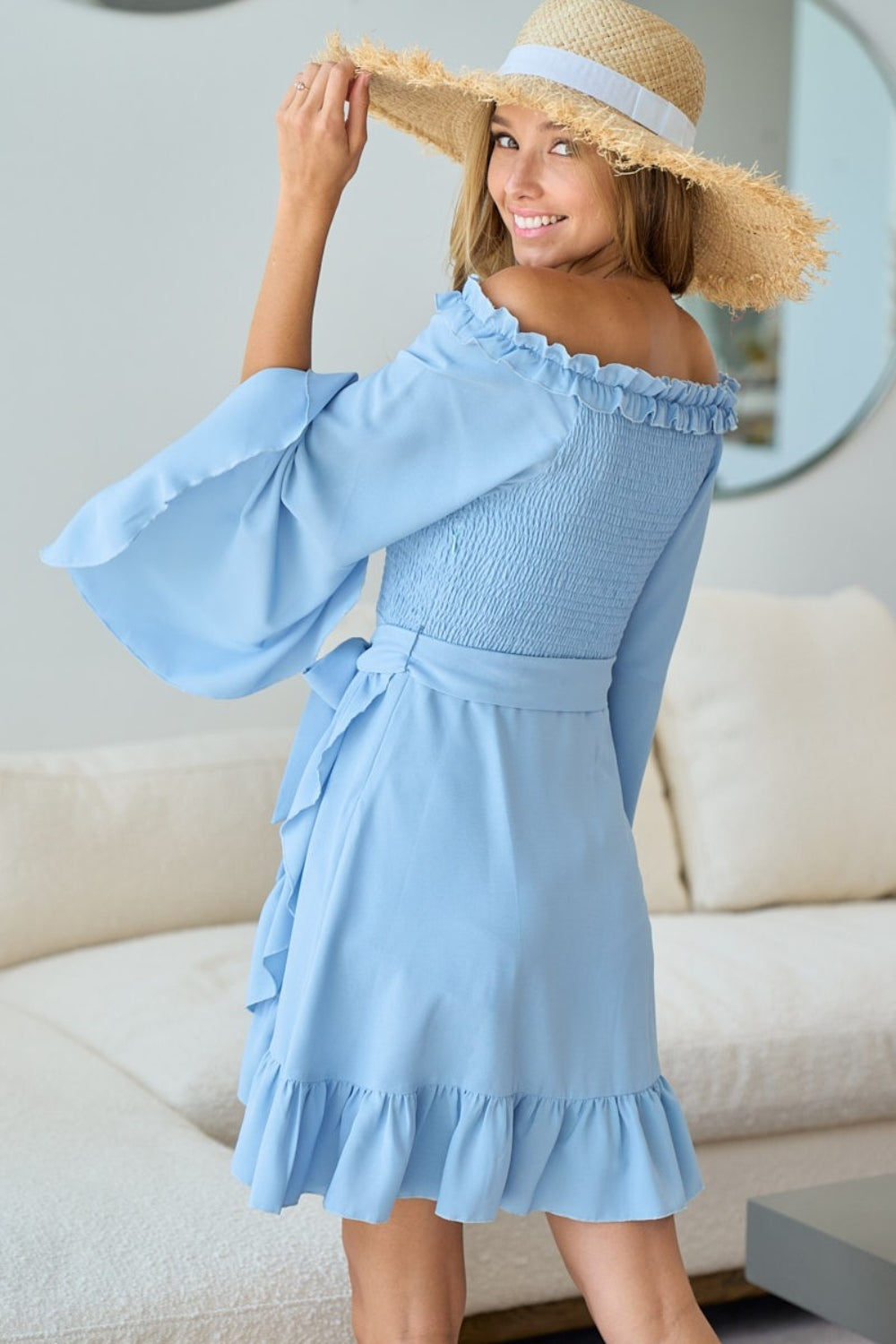 Effortlessly chic and trendy, the Rayna Mini Dress exudes femininity and style. Featuring a smocked bodice, ruffled details, and front tie accent, this dress offers a playful and romantic look. Perfect for any occasion, dress it down with sandals or up with heels for a polished ensemble.