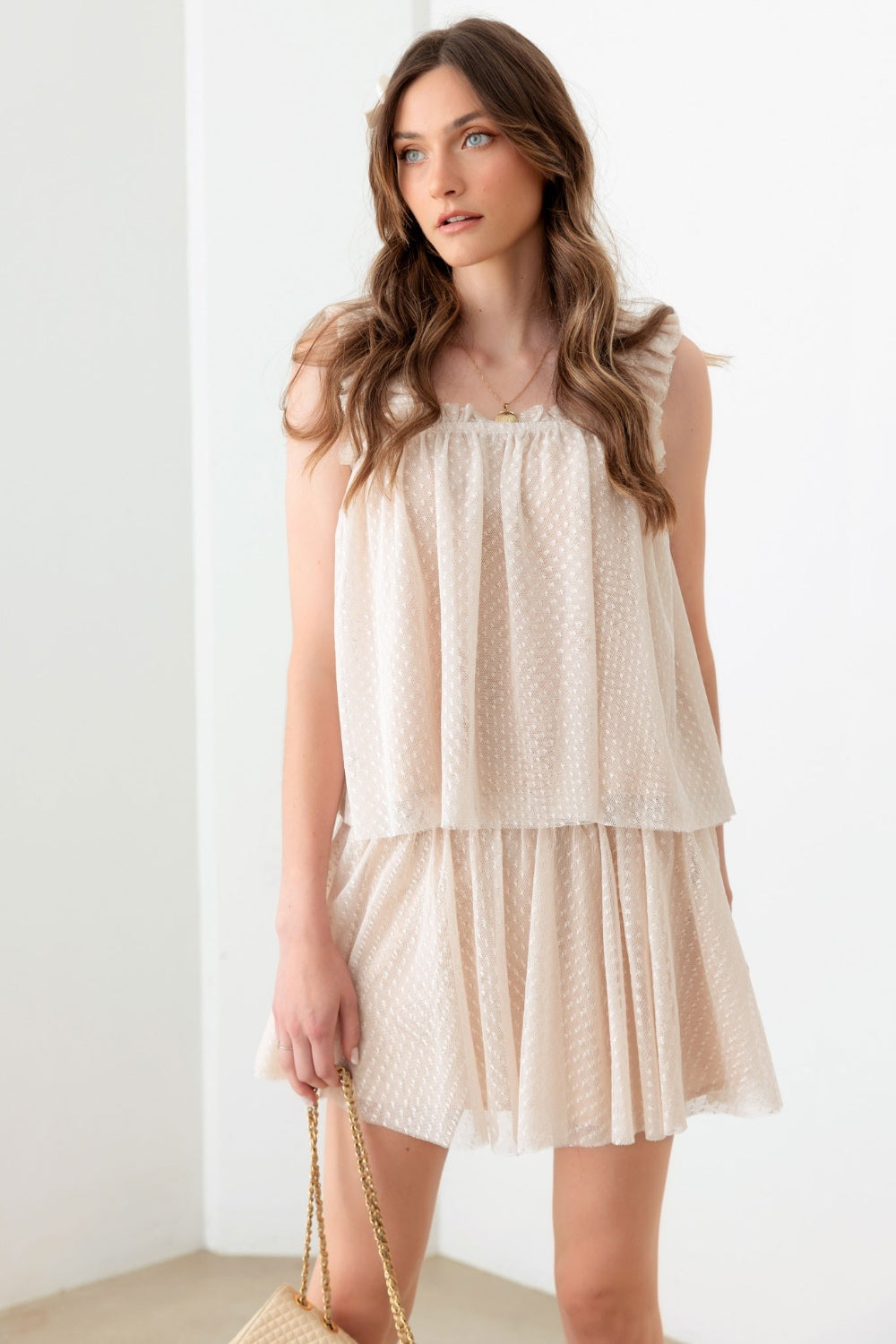 Get ready for date night with our Maci Tank & Skirt Set! This romantic set features a sheer pin dot top with wide elastic straps and a square neckline, plus a mini skirt with an elastic waist for a comfy and stylish look. Perfect for a flirty and fun date night.