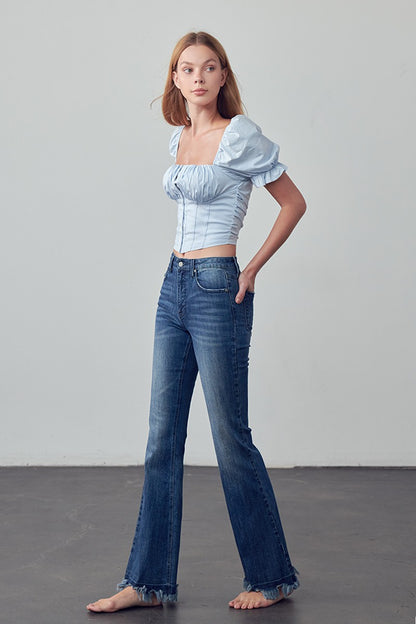 Crafted for those who crave comfort and style, the Emily Frayed Hem Flare Jeans have got you covered! Made from stretch denim for the perfect fit, their frayed hem adds a touch of edge. And let's not forget the pockets - because who doesn't love a functional detail? Designed with love in the USA. Model is 5'9" and is wearing a size 3  Garment measurements for size 3 Waist: 25 1/2", Hip 32 1/2", Front Rise 10", Leg Opening 21 1/2", Inseam 33"