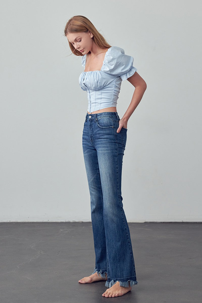 Crafted for those who crave comfort and style, the Emily Frayed Hem Flare Jeans have got you covered! Made from stretch denim for the perfect fit, their frayed hem adds a touch of edge. And let's not forget the pockets - because who doesn't love a functional detail? Designed with love in the USA. Model is 5'9" and is wearing a size 3  Garment measurements for size 3 Waist: 25 1/2", Hip 32 1/2", Front Rise 10", Leg Opening 21 1/2", Inseam 33"