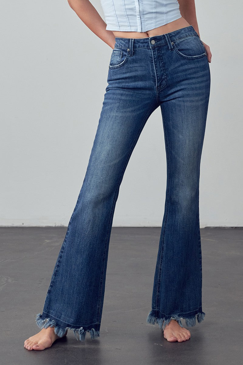 Crafted for those who crave comfort and style, the Emily Frayed Hem Flare Jeans have got you covered! Made from stretch denim for the perfect fit, their frayed hem adds a touch of edge. And let's not forget the pockets - because who doesn't love a functional detail? Designed with love in the USA. Model is 5'9" and is wearing a size 3  Garment measurements for size 3 Waist: 25 1/2", Hip 32 1/2", Front Rise 10", Leg Opening 21 1/2", Inseam 33"