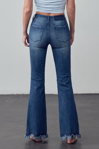 Crafted for those who crave comfort and style, the Emily Frayed Hem Flare Jeans have got you covered! Made from stretch denim for the perfect fit, their frayed hem adds a touch of edge. And let's not forget the pockets - because who doesn't love a functional detail? Designed with love in the USA. Model is 5'9" and is wearing a size 3  Garment measurements for size 3 Waist: 25 1/2", Hip 32 1/2", Front Rise 10", Leg Opening 21 1/2", Inseam 33"