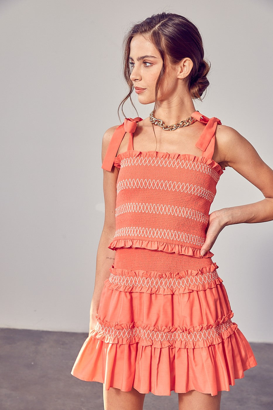Add some serious charm and style into your wardrobe with the Coral  Smocked Bow Strap Top. Whether you rock it casually with jeans or match it up with the Coral Tiered Ruffle Skirt for a flirty edge, this top has got you covered.  Model is 5'9" and is wearing a size Small Bust: 32", Waist: 24", Hips: 34"