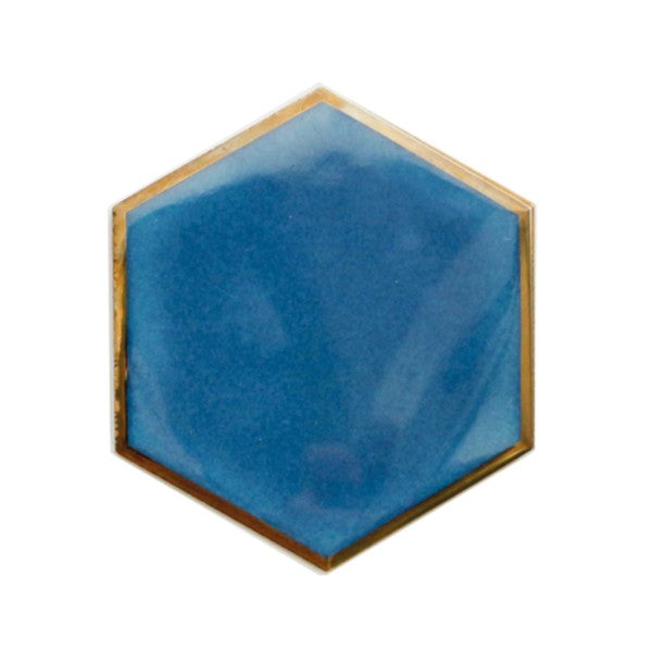 Unleash your inner creativity and add a touch of sophistication with this set of four hexagonal coasters, accented with gold edges and suede lining. Use them individually or combine them to create a heat-resistant base for hot dishes. Available in black, blue, and aqua, the possibilities are endless.  Ceramic Diameter: 4" Thermal insulation Set includes 4 pieces