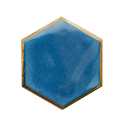 Unleash your inner creativity and add a touch of sophistication with this set of four hexagonal coasters, accented with gold edges and suede lining. Use them individually or combine them to create a heat-resistant base for hot dishes. Available in black, blue, and aqua, the possibilities are endless.  Ceramic Diameter: 4" Thermal insulation Set includes 4 pieces