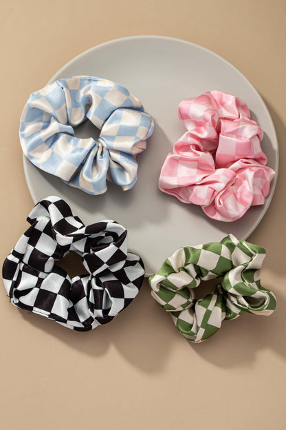 Upgrade your hair accessory collection with the Checker Satin Scrunchies. With its soft satin materials, these scrunchies are gentle on your hair, minimizing breakage and ensuring a comfortable hold.