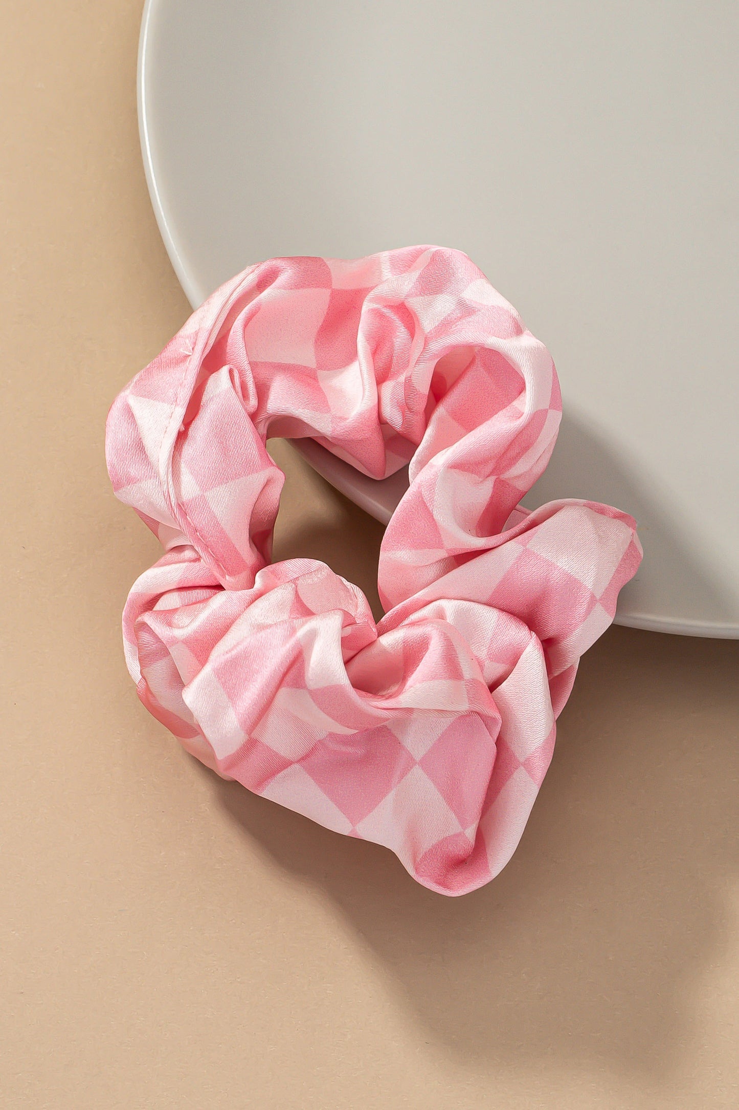 Upgrade your hair accessory collection with the Checker Satin Scrunchies. With its soft satin materials, these scrunchies are gentle on your hair, minimizing breakage and ensuring a comfortable hold.