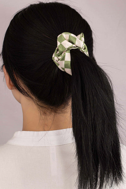 Upgrade your hair accessory collection with the Checker Satin Scrunchies. With its soft satin materials, these scrunchies are gentle on your hair, minimizing breakage and ensuring a comfortable hold.