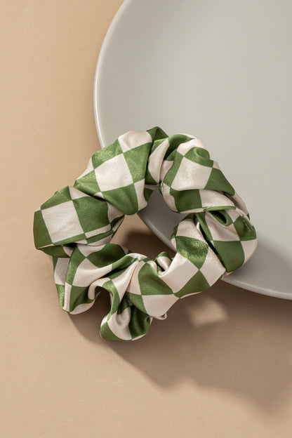 Upgrade your hair accessory collection with the Checker Satin Scrunchies. With its soft satin materials, these scrunchies are gentle on your hair, minimizing breakage and ensuring a comfortable hold.