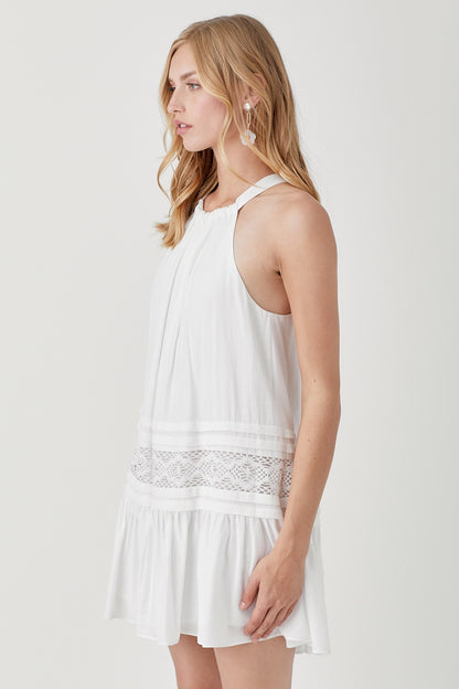 Our Nova Halter Neck Lace Dress adds romance and style to your wardrobe. Its halter neckline with delicate trim and elegant folded detail exudes an effortless vibe and vintage charm.&nbsp;