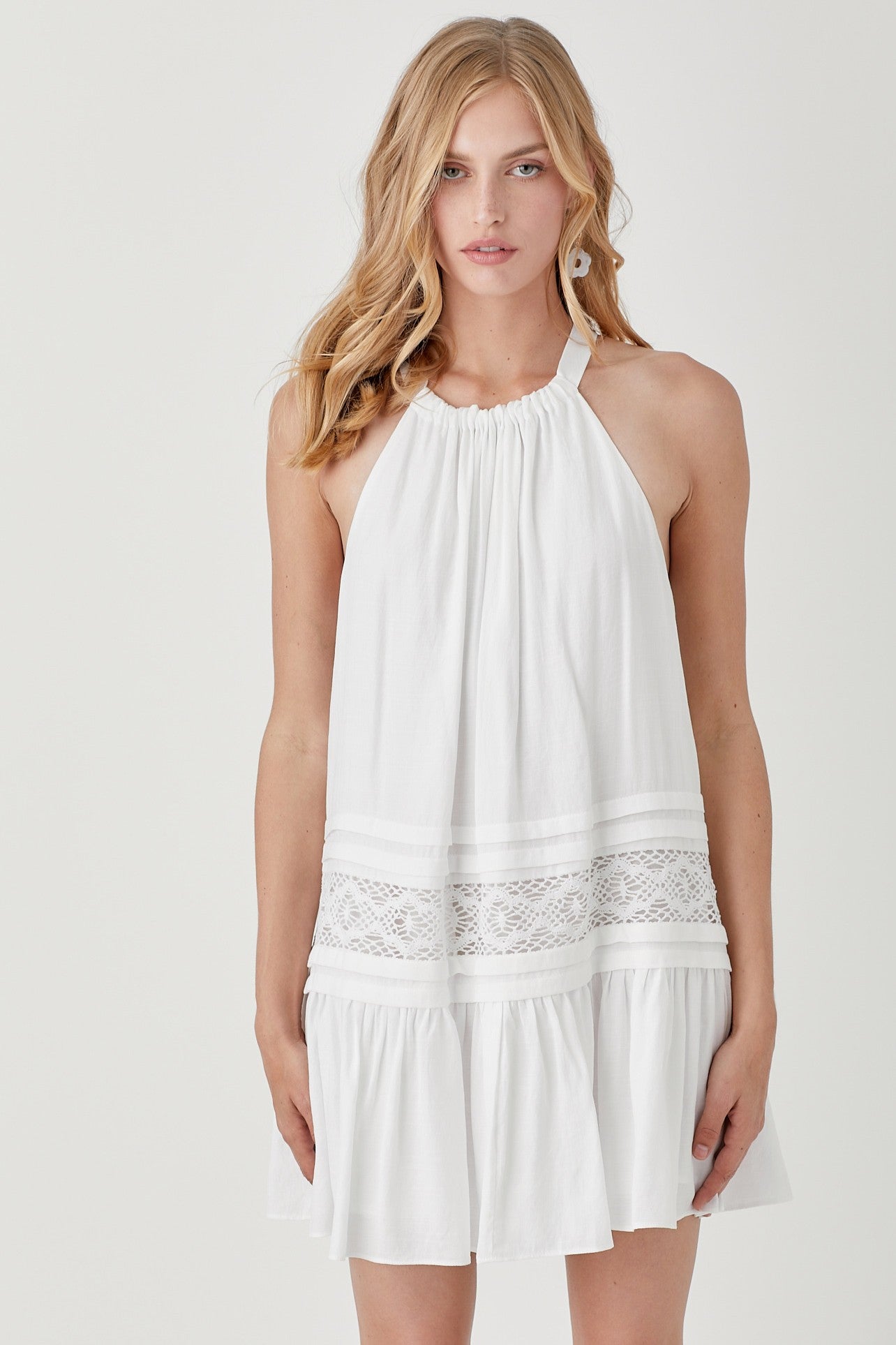 Our Nova Halter Neck Lace Dress adds romance and style to your wardrobe. Its halter neckline with delicate trim and elegant folded detail exudes an effortless vibe and vintage charm.&nbsp;