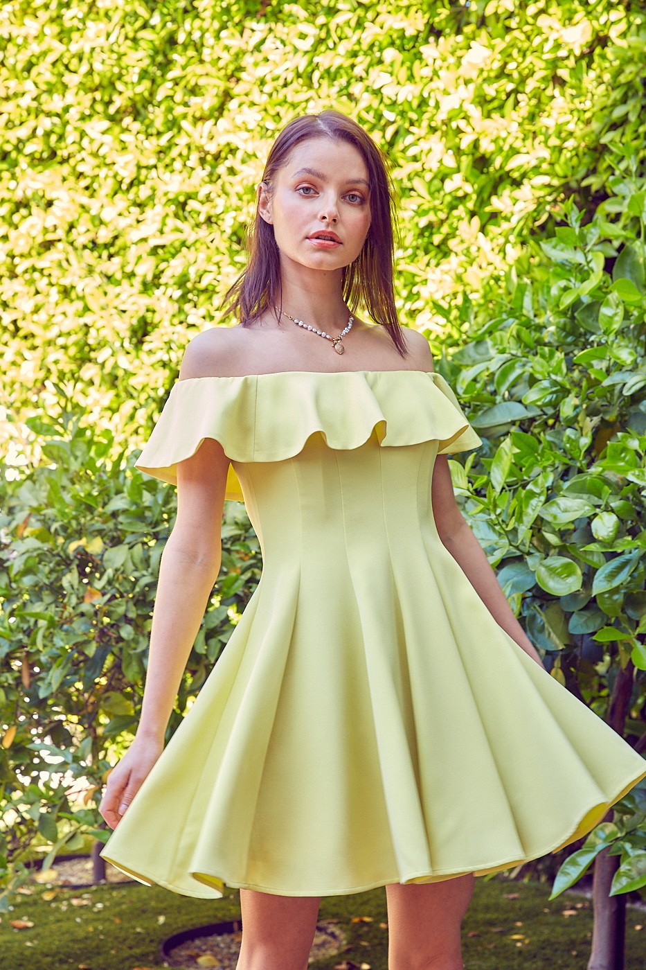 The Isabelle A-Line Ruffle Dress is graceful and feminine. Whether you're attending a garden party, a wedding, or a summer soiree, this dress is the epitome of elegance and versatility.  Model is 5'9" and is wearing a size Small Bust: 32", Waist: 24", Hip: 34"