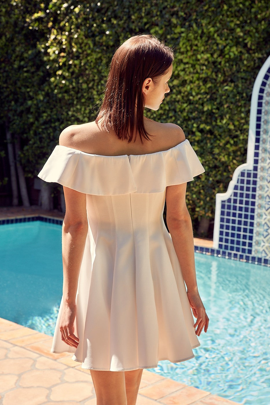 The Isabelle A-Line Ruffle Dress is graceful and feminine. Whether you're attending a garden party, a wedding, or a summer soiree, this dress is the epitome of elegance and versatility.  Model is 5'9" and is wearing a size Small Bust: 32", Waist: 24", Hip: 34"