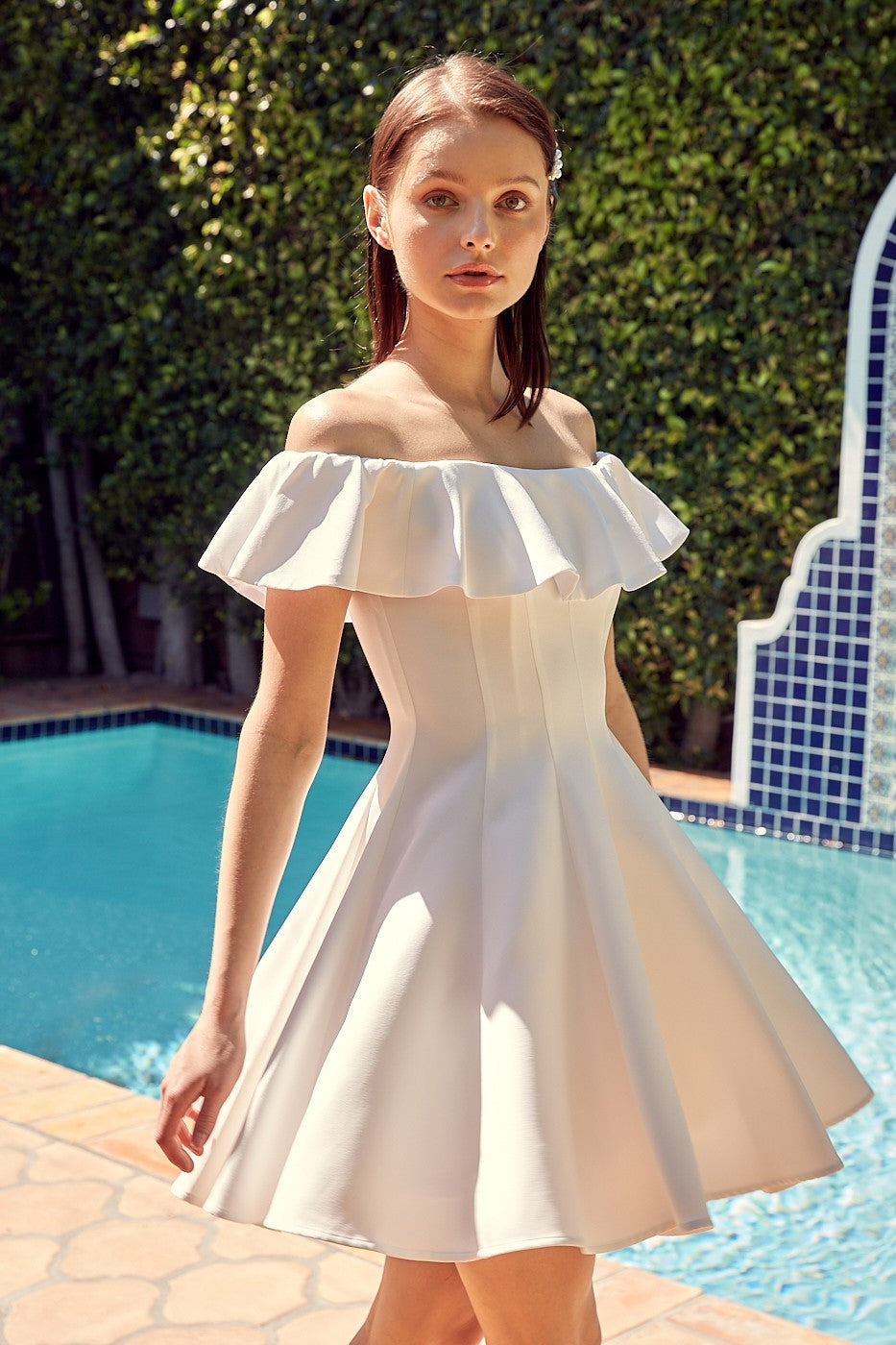 The Isabelle A-Line Ruffle Dress is graceful and feminine. Whether you're attending a garden party, a wedding, or a summer soiree, this dress is the epitome of elegance and versatility.  Model is 5'9" and is wearing a size Small Bust: 32", Waist: 24", Hip: 34"