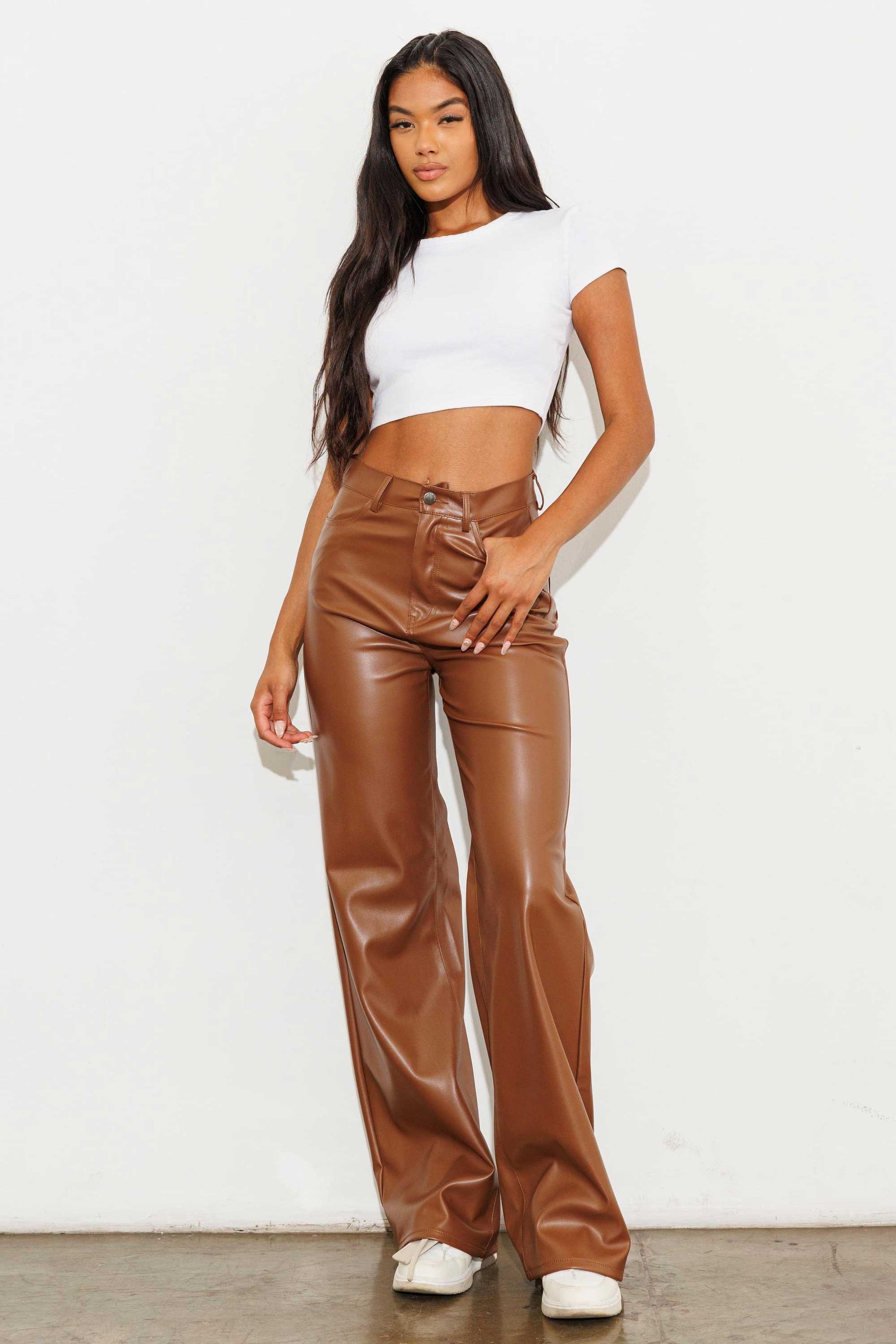 Unleash your stylish side with the Charlotte Vegan Leather Wide Leg Pants! Made from top-quality PU, these pants are both chic and ethical. With front and back pockets for convenience, plus a sleek zip-fly closure, these pants are a must-have for any fashion-forward wardrobe.  Model is 5'8" and wearing a size 3