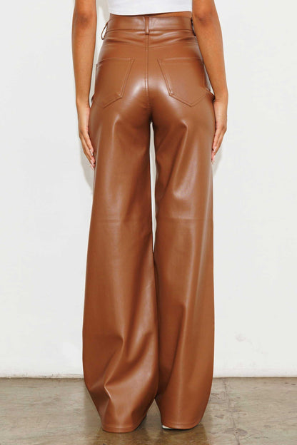 Unleash your stylish side with the Charlotte Vegan Leather Wide Leg Pants! Made from top-quality PU, these pants are both chic and ethical. With front and back pockets for convenience, plus a sleek zip-fly closure, these pants are a must-have for any fashion-forward wardrobe.  Model is 5'8" and wearing a size 3