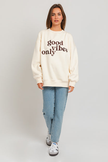 Stay warm and stylish with our oversized sweatshirt featuring embroidered letters and designs. Personalize your outfit with this cozy fashion statement.  Model is 5'8" and is wearing a size small Bust: 32A, Waist: 24", Hips: 34"