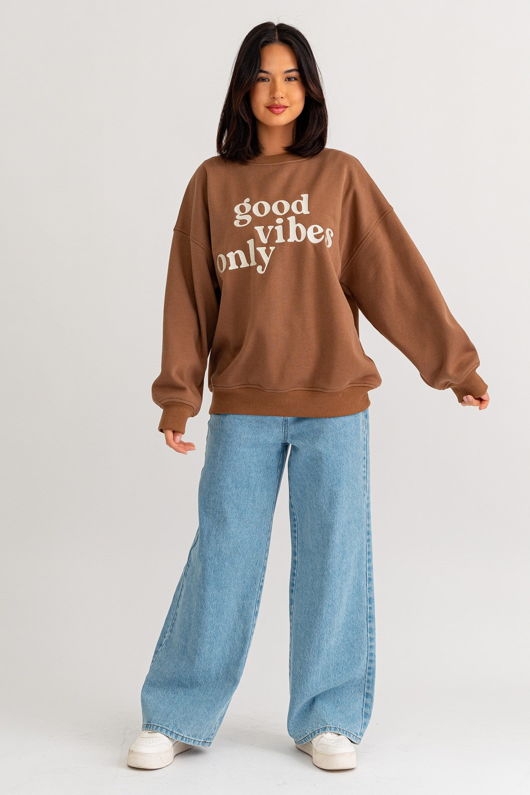 Stay warm and stylish with our oversized sweatshirt featuring embroidered letters and designs. Personalize your outfit with this cozy fashion statement.  Model is 5'8" and is wearing a size small Bust: 32A, Waist: 24", Hips: 34"