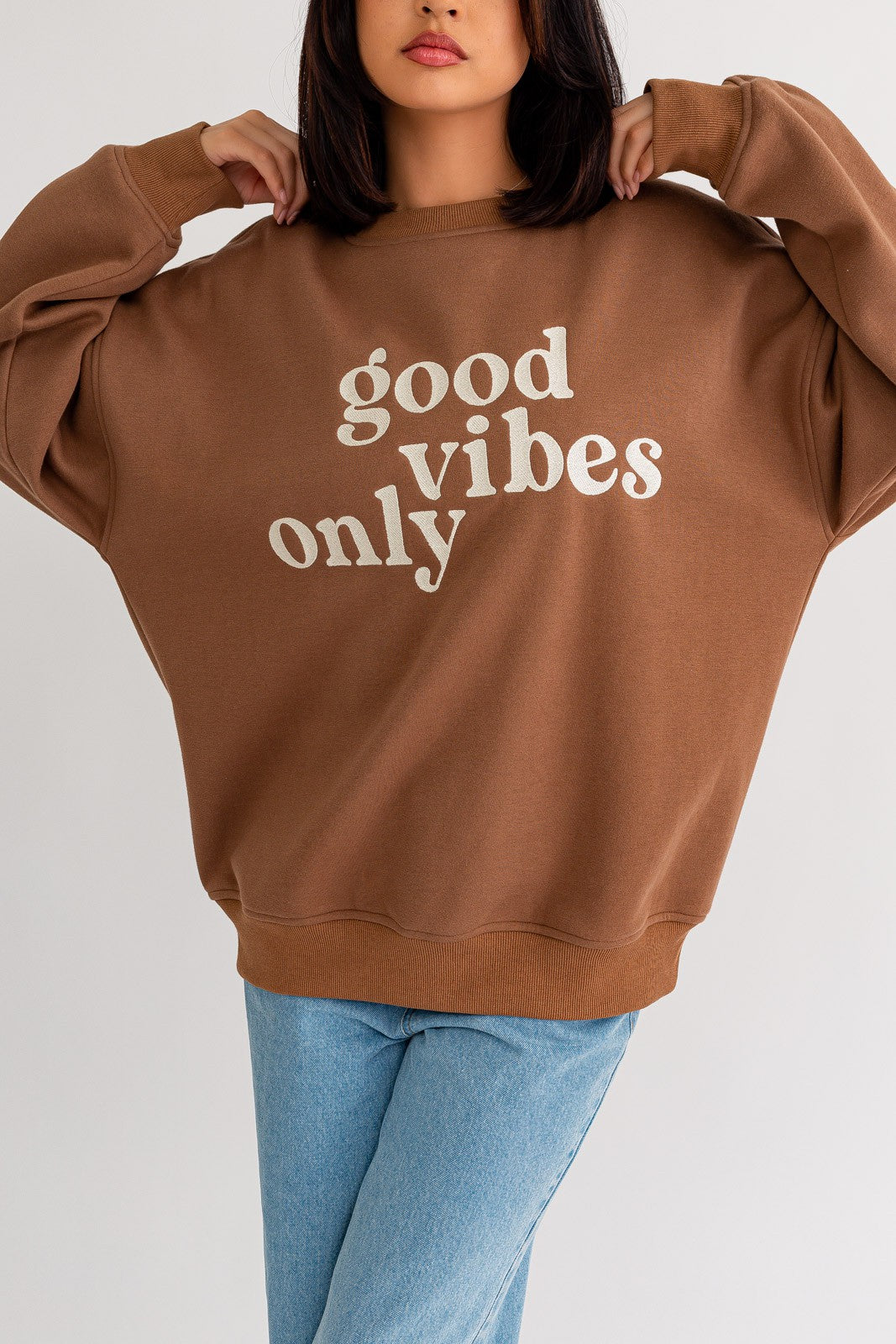 Stay warm and stylish with our oversized sweatshirt featuring embroidered letters and designs. Personalize your outfit with this cozy fashion statement.  Model is 5'8" and is wearing a size small Bust: 32A, Waist: 24", Hips: 34"