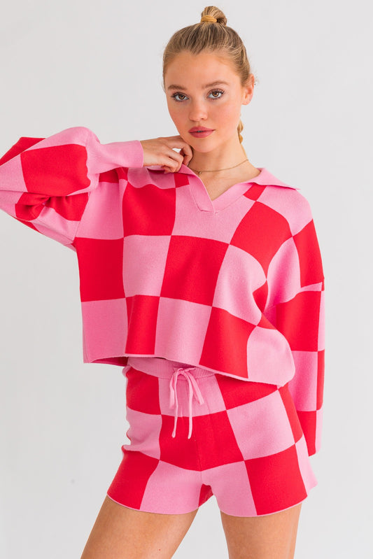 Achieve a laid-back yet trendy look with our Think Pink Checkered Pullover Top. The loose-fitted silhouette ensures comfort all throughout your day. Paired with our matching Think Pink Checkered Sweater Shorts, this set exudes a relaxed and effortless style.
