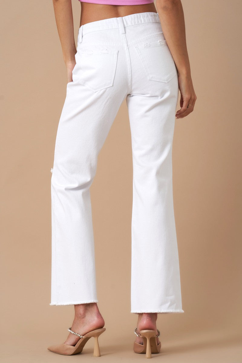 Get ready to rock with these Morgan High Rise Slim Straight jeans made from 100% cotton. Featuring knee distressing for a relaxed fit, these White Denim jeans have 5 pockets and are proudly Designed In USA.  Model is wearing size 3/25, Height 5'8 Waist: 29 1/2, Hip: 38 1/2 Front Rise - 10, Leg Opening - 18, Inseam - 29