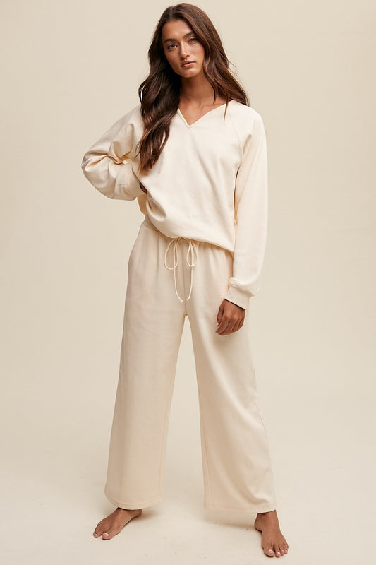 The Paisley Loungewear V-neck Sweatshirt and Pants Set is the epitome of casual comfort with a touch of style. The set offers a relaxed yet flattering fit, perfect for lounging or running errands. This set provides an effortlessly coordinated look that is both cozy and on-trend for laid-back days.