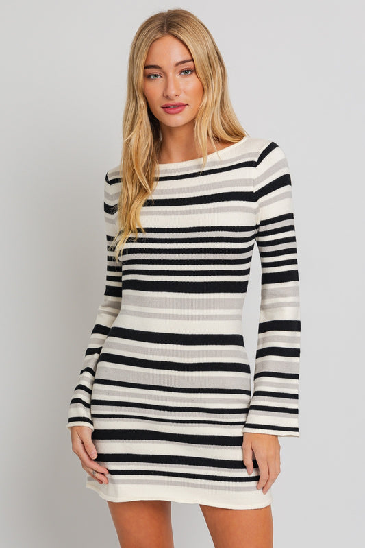Introducing the Sofia Boat Neck Bell Sleeve Sweater Dress. An embodiment of comfort and style. This dress combines the classic appeal of a boat neck with the trendy flair of bell sleeves, creating a chic and versatile ensemble. The relaxed fit offers a flattering silhouette, making it suitable for various body types.