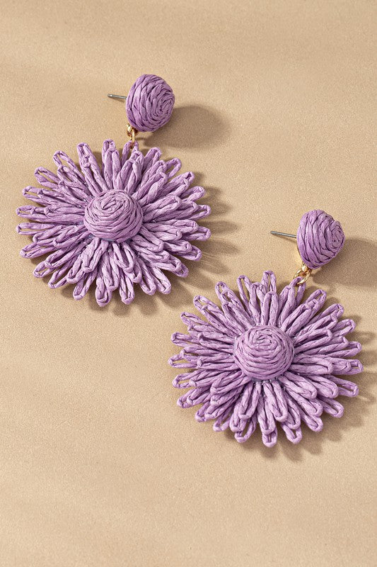 Discover bohemian charm with our 3-Layer Raffia Straw Flower Drop Earrings. Adorable and whimsical, these earrings feature intricately woven raffia in a delicate flower design. Perfect for casual or special occasions, they add a touch of nature-inspired elegance to your style. Embrace individuality with these statement earrings that bring both flair and grace to any ensemble.