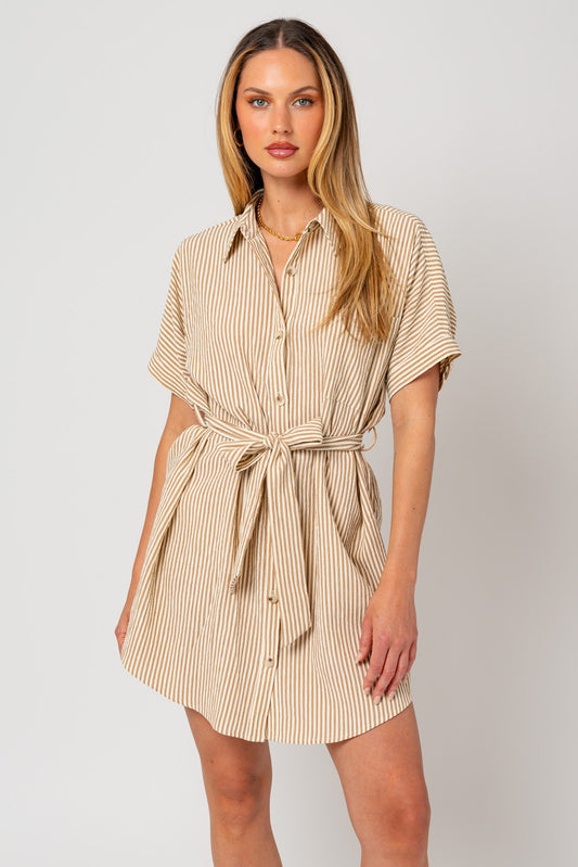 Our Gianna Button Down Shirt Dress is made from soft and breathable fabric, this dress features a classic button-down design with a relaxed fit that flatters any body type.