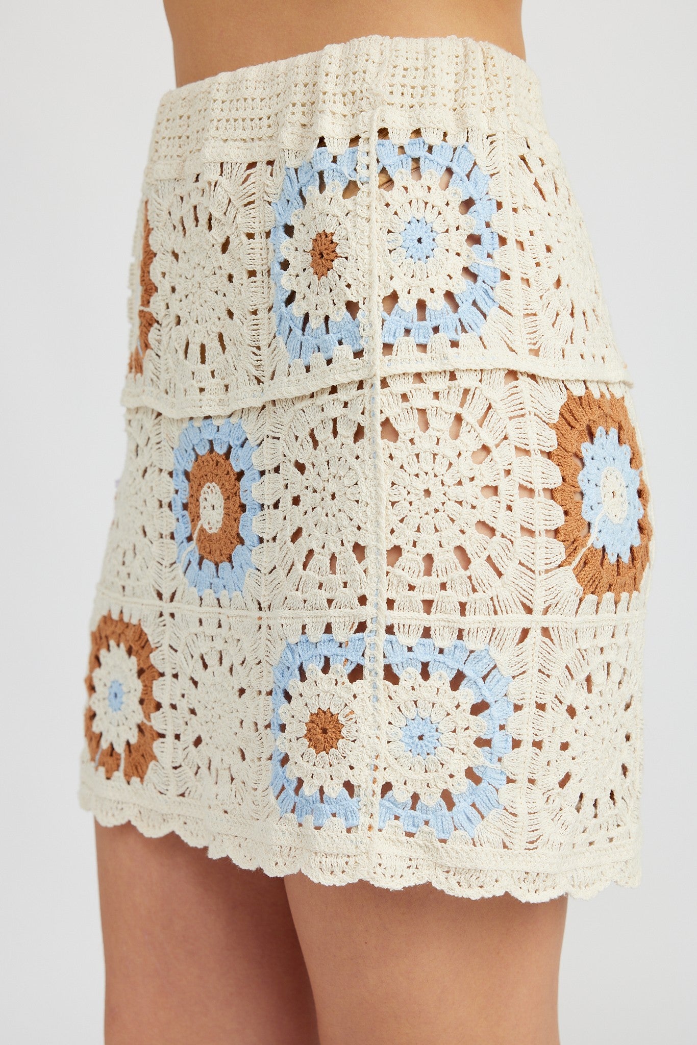 Get ready to make a statement with the Maverick Mini Skirt! This unique skirt features a fun and playful crochet design that will have you standing out from the crowd. Embrace your fun side with this must-have mini skirt.  Model is 5'9" and wearing a size Small