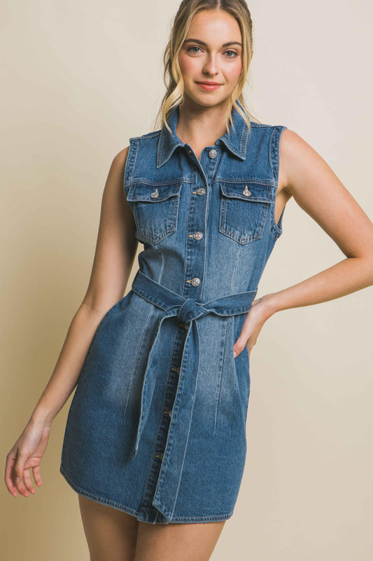 The Julia Denim Dress With Waist Tie is crafted from durable denim fabric. The waist tie detail adds definition and allows you to cinch the dress for a flattering silhouette.