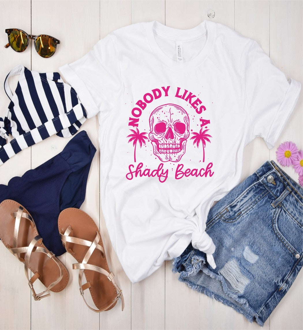 No shady business here - rock this beach tee and let the world know you're all about those sunny vibes. Made with 100% combed, ring spun cotton, this tee is a perfect addition to any beach day outfit. Because let's be real, no one likes a shady beach (or person).&nbsp;