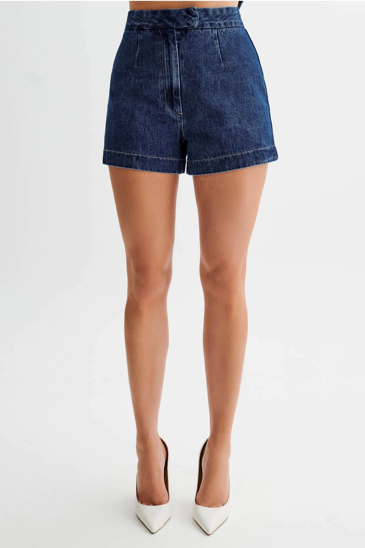 The Gianna Denim Two Piece Set combines stylish denim vest and shorts, designed with a round neck and sleeveless cut for a chic finish that will elevate your summer wardrobe.