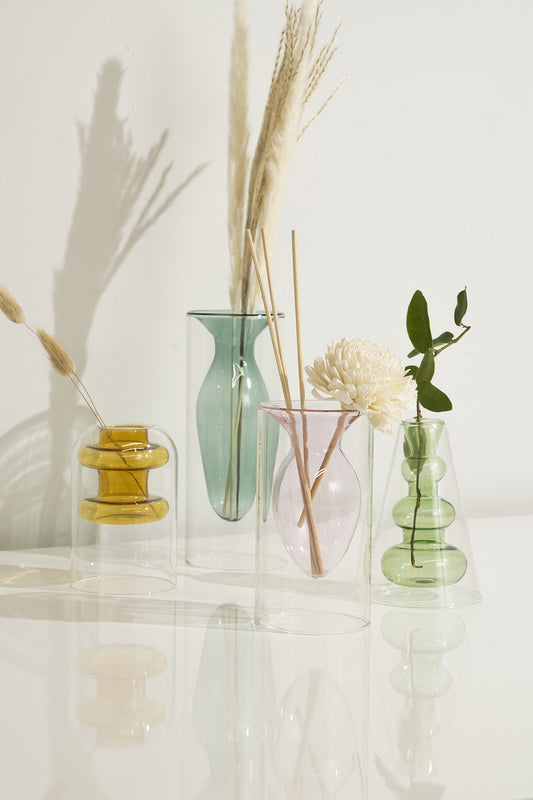 These Borosilicate Glass Crystal Vases are elegant and timeless decor items that will elevate any space. Made from high-quality borosilicate glass, which is known for its durability and resistance to thermal shock. Perfect for displaying fresh flowers, decorative stones, or any other items you want to showcase in a stylish way. Bring a touch of luxury to your home or office with these stunning vases.<br><br>** Each set includes 3 vases - green/turquoise/yellow