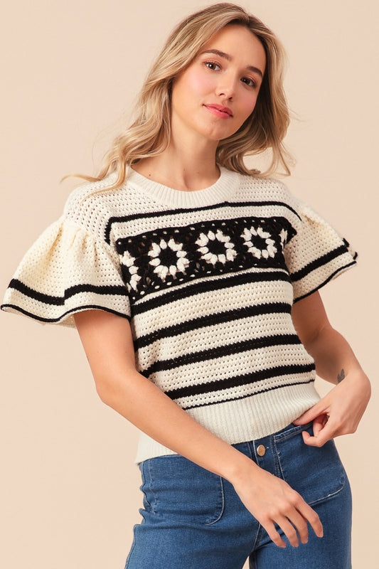 Unique and stylish Daisy Square Short Sleeve Striped Sweater. Perfect for transitioning between seasons. Whether paired with high-waisted jeans for a retro-inspired outfit or layered over a dress for a bohemian touch, this sweater adds a fun and fashionable twist to your wardrobe.