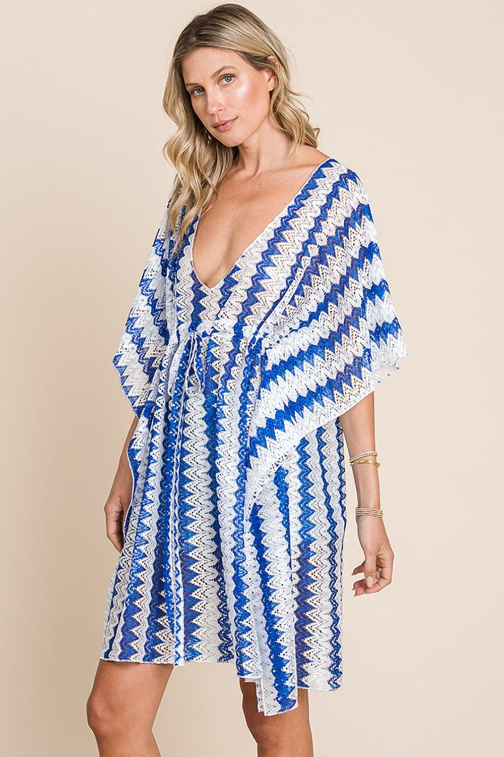 Featuring a classic striped pattern, plunging neckline, and tied details, this versatile piece is perfect for any warm day. Layer over swimsuits or pair with shorts for a trendy summer look. Effortlessly elevate your beach style with our Lola Crochet Lace Cover Up in Blue.