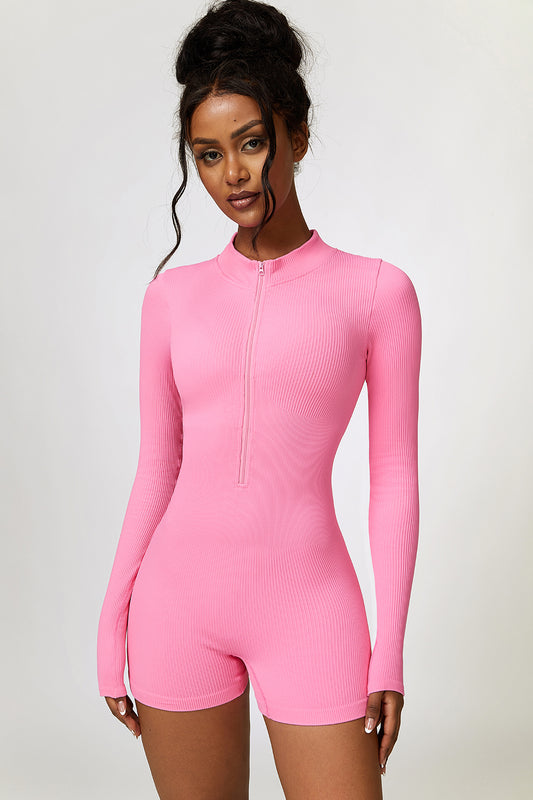 Slip into this Half Zip Long Sleeve Active Romper and slip into total comfort! Made for the active lifestyle, this comfortable and stylish piece is perfect for pilates or running errands around town. Available in 5 different color-ways so you can feel your best and most confident. Pink Half Zip Long Sleeve Active Romper