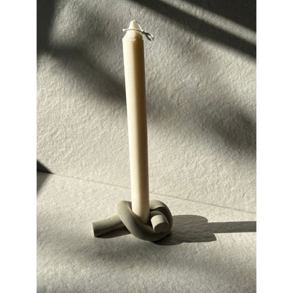 Simple, cute and lightweight. The perfect way to display your taper candles. All of our Concrete pieces are handmade in Canada. No two items are alike, as small bubbles and minor imperfections may appear, adding character to each rustic piece. Made with concrete. Not dishwasher safe.