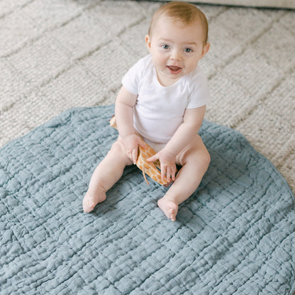 Hand-woven with love, our quilted linen play mats are made from the very softest natural fibers and dyed in delicate, neutral hues. Thick cotton filling and our signature stone washed linen make this mat cozy, portable and easy to wash. We use premium Belgian flax dyed in small batches by skilled artisans. Slight color variations may occur between batches that add to the unique hand-crafted beauty of each item. 