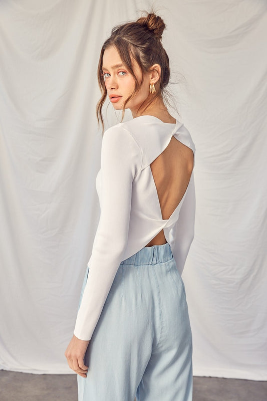 The Ivy Twisted Backless Top is a chic piece that is perfect for adding a touch of style to your wardrobe. Pair this top with high-waisted pants or a skirt for a fashionable and sophisticated look.