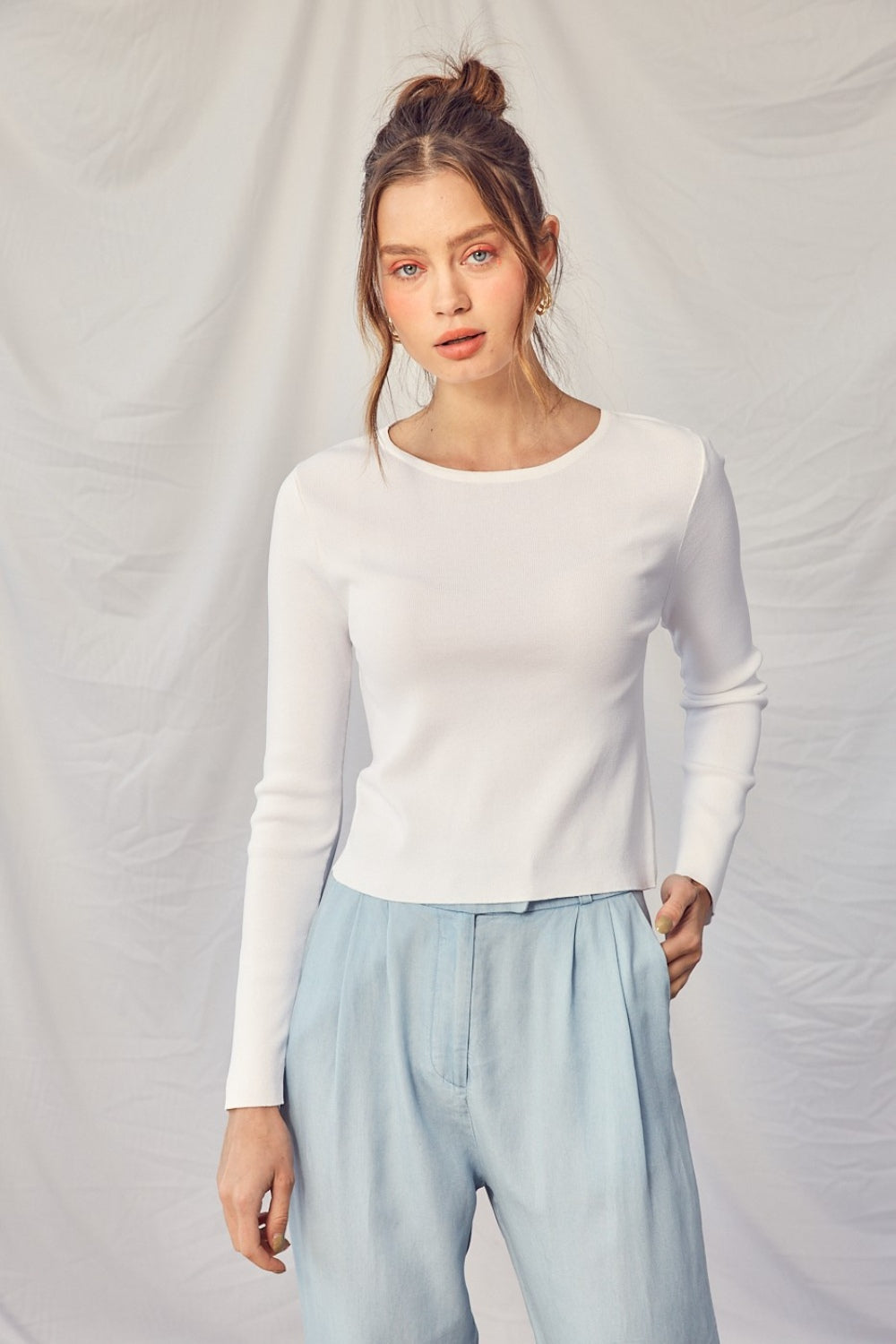 The Ivy Twisted Backless Top is a chic piece that is perfect for adding a touch of style to your wardrobe. Pair this top with high-waisted pants or a skirt for a fashionable and sophisticated look.