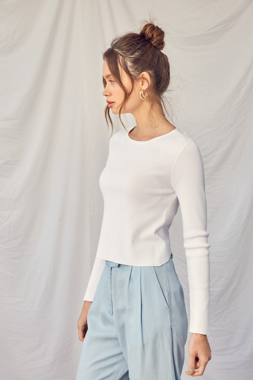 The Ivy Twisted Backless Top is a chic piece that is perfect for adding a touch of style to your wardrobe. Pair this top with high-waisted pants or a skirt for a fashionable and sophisticated look.